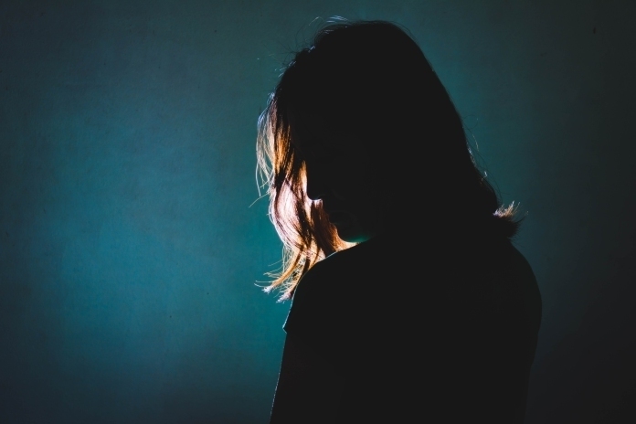 woman silhouette on dark background