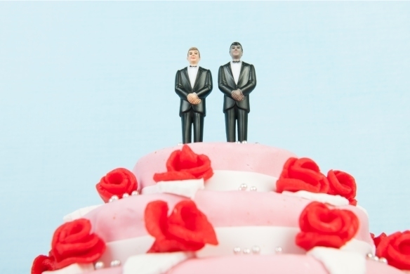 wedding cake with 2 men on the top